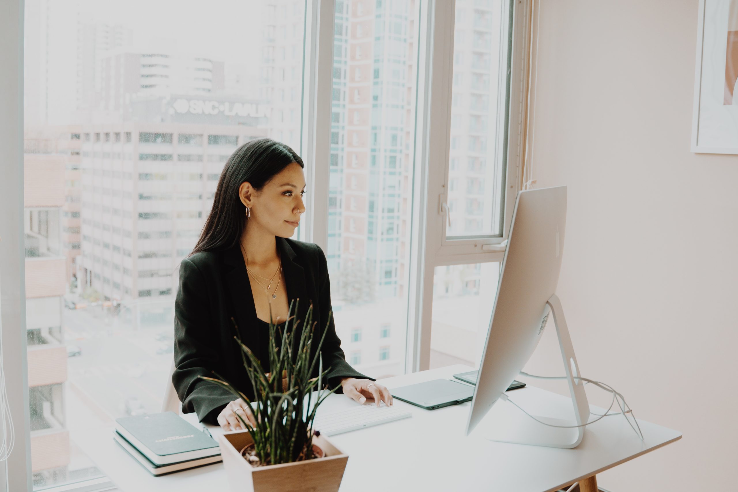 woman using the computer in her office